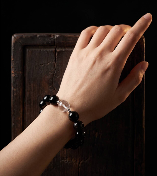 Obsidian bead bracelet with 10mm beads shown on a wrist