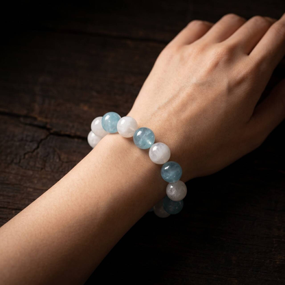 Aquamarine and Snow White Phantom Quartz bracelet worn on the wrist
