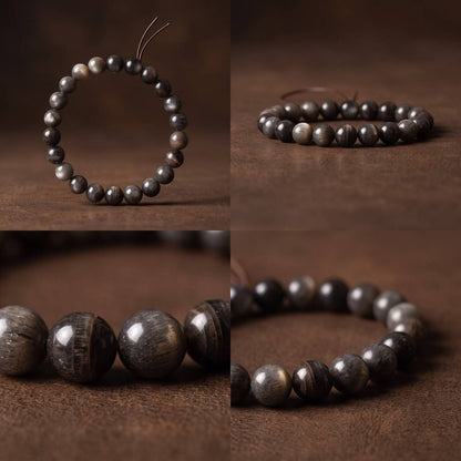 Close-up of dark 7mm Black Gold Sunstone beads with golden shimmer