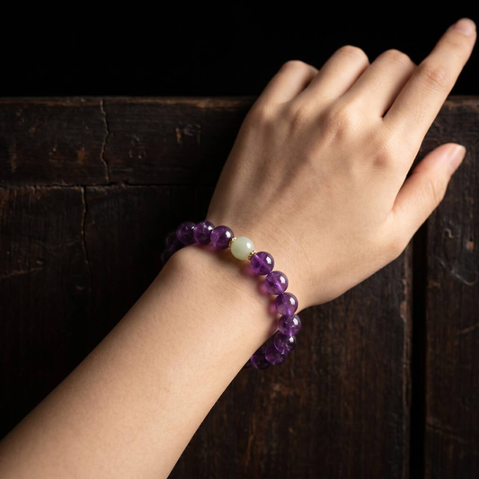 Amethyst bead bracelet with 10mm beads shown on a wrist