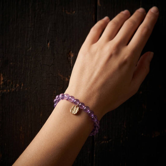 6mm amethyst bracelet worn on the wrist
