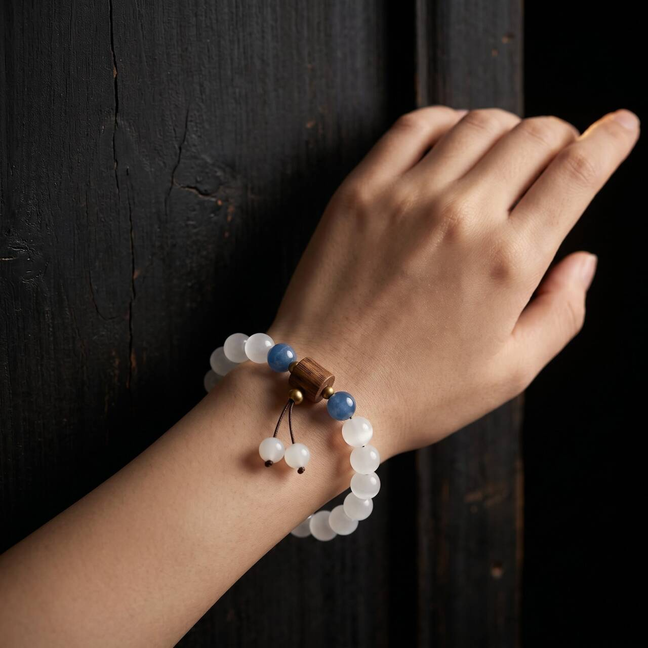 Creamy white Hetian jade bracelet worn on the right wrist
