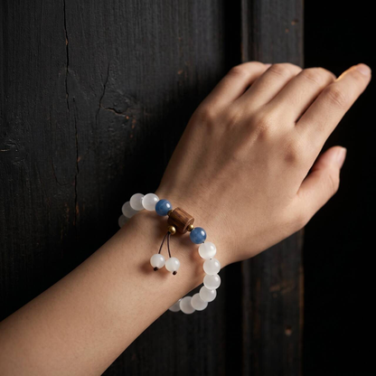Creamy white Hetian jade bracelet worn on the right wrist