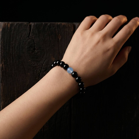 Wrist view of a 10mm obsidian bead bracelet