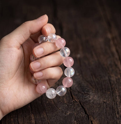 10mm rose quartz, White Crystal, and White Phantom Quartz bracelet held in hand
