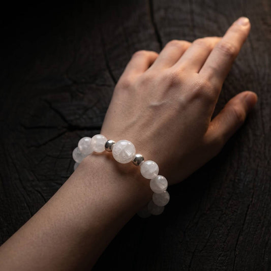 Snow Phantom Quartz bracelet worn on the wrist