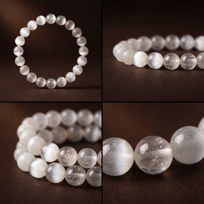 Close-up of 7mm White Rutilated Quartz beads with silky inclusions
